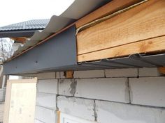 the side of a house being built with wood and metal