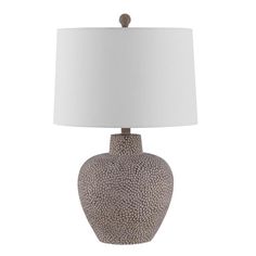 a table lamp with a white shade on it