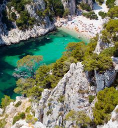 an aerial view of the blue lagoons and cliffs near split rock formations in croatia