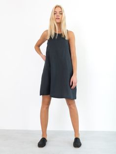 "LILY is a sleeveless midi dress inspired by 1960s mod style. Cut in slight flare shape to be worn floaty. DETAILS - High neckline - Sleeveless design - Knee length - Oeko-Tex certified 100% local washed midweight linen - Cut and sewn to order just for you in our studio COLOR - Dark Grey, you can also choose other colors above - Fabric samples are available here https://www.etsy.com/listing/586569696/linen-fabric-samples SIZING & FIT - Fits true to size - Length (shoulder to hem) is approxim Linen Slip Dress, Linen Summer Dress, Sleeveless Linen Dress, Linen Tunic Tops, Linen Shift Dress, Strappy Midi Dress, 1960s Mod, Linen Summer, Summer Linen Dresses