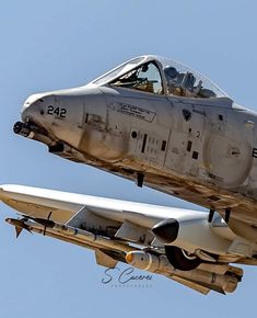 two fighter jets flying side by side in the sky