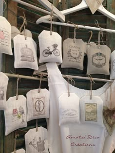 several tea towels are hanging on a clothes line