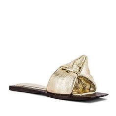 Jeffrey Campbell Aeron Flat Slide Sandal - Metallic Leather Upper With Leather Sole. Padded Footbed. Square Toe And Heel. Knot Accent At Vamp. Imported. Brand New In Box Color: Gold Size: 7 Sold Out Hard To Find Elegant Gold Flat Slides, Chic Gold Slip-on Slides, Chic Gold Open Toe Slides, Gold Slide Mules For Summer, Chic Gold Slides For Vacation, Gold Slides For Spring Party, Chic Gold Slides For Spring, Gold Round Toe Slides For Spring, Gold Slide Mules For Spring