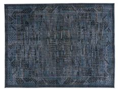 an antique rug with blue and grey colors on the ground, in front of a white background