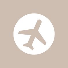 an airplane is flying through the air in front of a white circle on a beige background