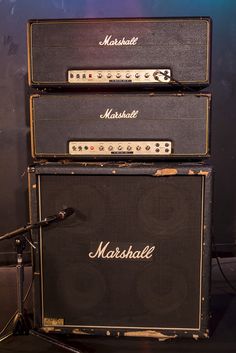 three marshall amps stacked on top of each other