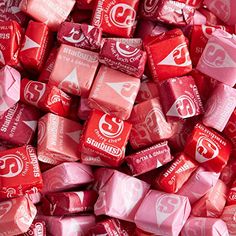 red and pink candy cubes stacked on top of each other with the word's logo