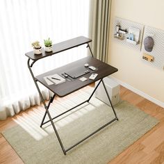 a table with two trays on it in front of a window