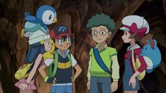 three young people standing next to each other in front of a tree with pokemon on it