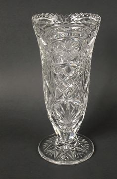 a clear glass vase sitting on top of a table