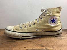 "this old man vintage presents ... oh wow.  amazing pair of chucks from 1970-80s.  pale yellow canvas.  black stripes along the bottom of the foot. classic all-star \"patch\". 8 hole lace ups tagged ... converse Made in USA  All Star measurements ... vintage size: 10 outside length (toe to heel): 12 inches outside ball of foot: 4 inches condition ... a little dingy, especially near the toes. the inside is pretty clean and the soles have lots of life. see pictures for more details. * I know some Vintage Yellow Sneakers For Streetwear, Yellow High-top Cotton Sneakers, Yellow Cotton High-top Sneakers, Vintage Cream Sneakers With Vulcanized Sole, Vintage Canvas Shoes With Rubber Sole For Streetwear, Vintage High-top Cream Sneakers, Vintage Yellow High-top Sneakers, Vintage Cream High-top Sneakers, Vintage Canvas Sneakers With Vulcanized Sole