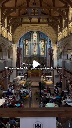 the inside of a church with people sitting at tables