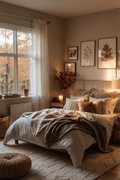 a bedroom with a large bed and lots of pictures on the wall next to it