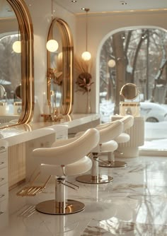 the interior of a hair salon with chairs, mirrors and lights on the wall in front of large windows