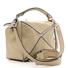 This is an authentic LOEWE Calfskin Medium Puzzle Bag in Piedra. This stunning bag is crafted of calfskin leather in beige. The bag features a rolled leather handle, a rear zipper pocket, an adjustable leather shoulder strap with polished gold hardware. The top zipper opens to a natural fabric interior with patch pockets. Puzzle Bag, Natural Fabric, Natural Fabrics, Leather Handle, Gold Hardware, Patch Pocket, Zipper Pocket, Calf Skin, Shoulder Strap