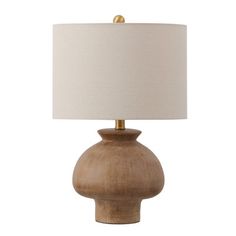 a wooden table lamp with a white shade