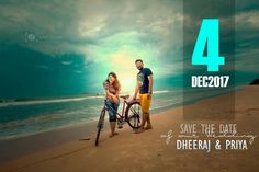 a man and woman standing next to a bike on a beach with the ocean in the background