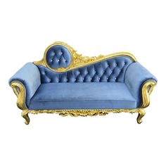 a blue couch with gold trimmings on the back and arms, sitting against a white background