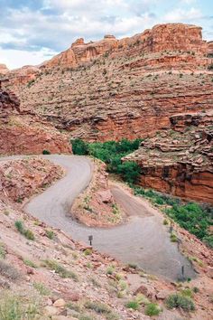 a winding road in the middle of some mountains