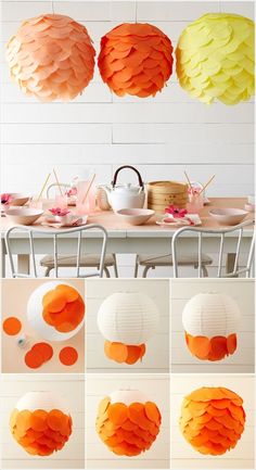 paper lanterns are hanging from the ceiling above a table