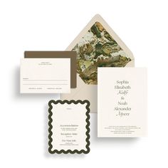 the wedding stationery is set up with two envelopes and one lettered card