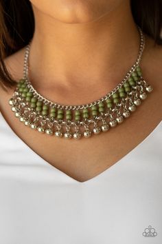 Threaded along dainty silver rods, stacks of green stone beads give way to a row of shiny silver beads, creating an earthy fringe below the collar. Features an adjustable clasp closure.

Sold as one individual necklace. Includes one pair of matching earrings. Short Silver Necklace, Paparazzi Accessories Jewelry, Coordinates Jewelry, Inexpensive Jewelry, Green Stone Necklace, Green Beaded Necklace, Beaded Necklace Designs, Jewelry Boutique, Silver Bead Necklace