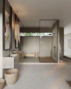 a bathroom with a large walk in shower next to a sink and toilet area on the side