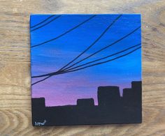 an acrylic painting of a city skyline at dusk with power lines in the sky