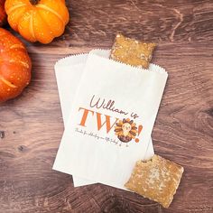 there are two bags that say william and twp on them next to some pumpkins