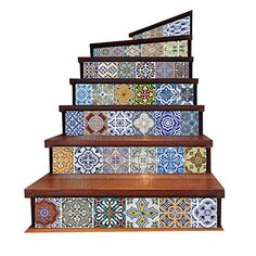 a set of stairs with colorful tiles painted on them