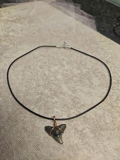 Fossilized shark tooth pendant necklace on a cord. Shark Tooth Pendant, Tooth Pendant, Shark Tooth, Charm Necklaces, Pretty Jewelry, Shark Teeth, Pretty Jewellery, Art Stuff, Charm Necklace