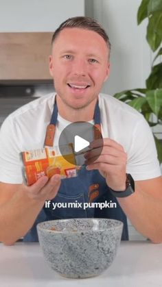 a man in an apron holding up a box of pumpkins with the words if you mix pumpkin seeds