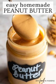 peanut butter in a mason jar with a spoon full of peanut butter and the words easy homemade peanut butter