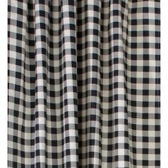 the black and white checkered curtains are closed