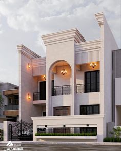 a large white building with two balconies on the second floor