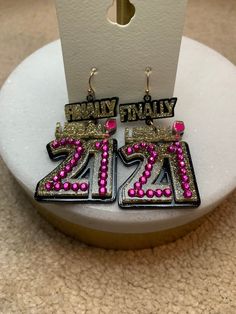 Light up your 21st birthday celebration with these sparkling rhinestone and gold-plated earrings! Adorned with eye-catching sparkles, these statement earrings grab attention and are perfect for making the night special. Commemorate this momentous age and show off your style with Finally Legal 21st Birthday Earrings! 21st Birthday Celebration, Birthday Earrings, Gold Plated Earrings, 21st Birthday, Birthday Celebration, Statement Earrings, Light Up, Gift Card, Sparkle