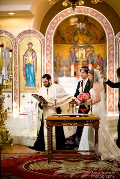 the bride and groom are getting married at the alter