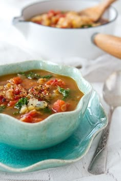 a bowl of soup is sitting on a table