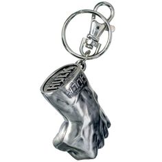 a metal keychain with a silver head on it