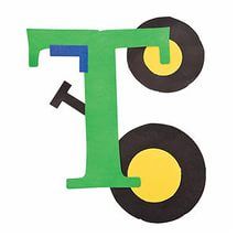 the letter t is made out of construction paper and has wheels on each one side