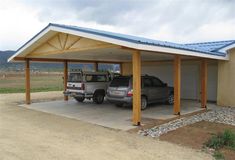 two cars are parked in a carport attached to a house