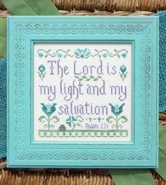 the lord is my light and my salvation cross stitch pattern in blue frame with green ribbon