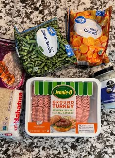 the ingredients are laid out on the counter for making this meal, including carrots, green beans, and ground beef