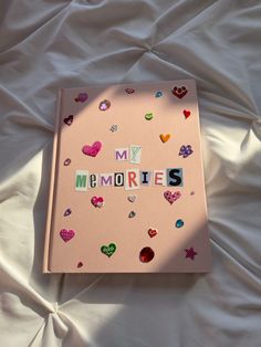 Light pink scrapbook with newspaper lettering spelling My Memories. Decorated with aesthetic heart stickers and jewels. Memories Scrapbook, Album Journal, Memory Journal, My Memories, Cover Journal, Seni Dan Kraf, Summer Scrapbook, Scrapbook Book