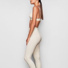 These cotton leggings hug the body yet allow your skin to breathe with cool and comfy natural fibers. The classic, rustic design elevates your lounge look. | SKIMS Legging | White | Cotton Rib Cotton Fitted Activewear For Pilates, Fitted Cotton Activewear For Pilates, Fitted Athleisure Leggings With Ribbed Waistband, Fitted Gym Leggings With Ribbed Waistband, Fitted Yoga Leggings With Ribbed Waistband, Versatile Fitted Activewear, Versatile Fitted Everyday Activewear, Fitted Seamless Activewear, Seamless Fitted Sportswear Leggings