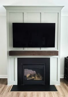 a fireplace with a flat screen tv above it