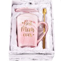 a pink coffee mug with the words best mom ever on it in a gift box