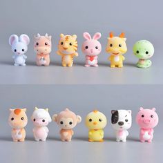 there are many small toy animals lined up in the same row, each with different colors and sizes