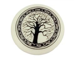 a black and white tree of life on a white background with an intricate border around it