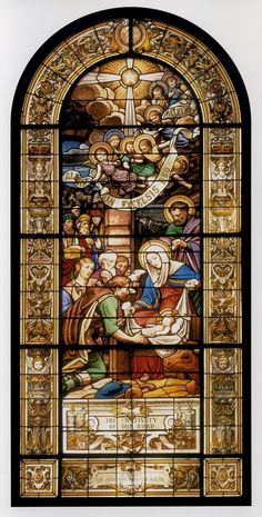 a stained glass window depicting the birth of jesus